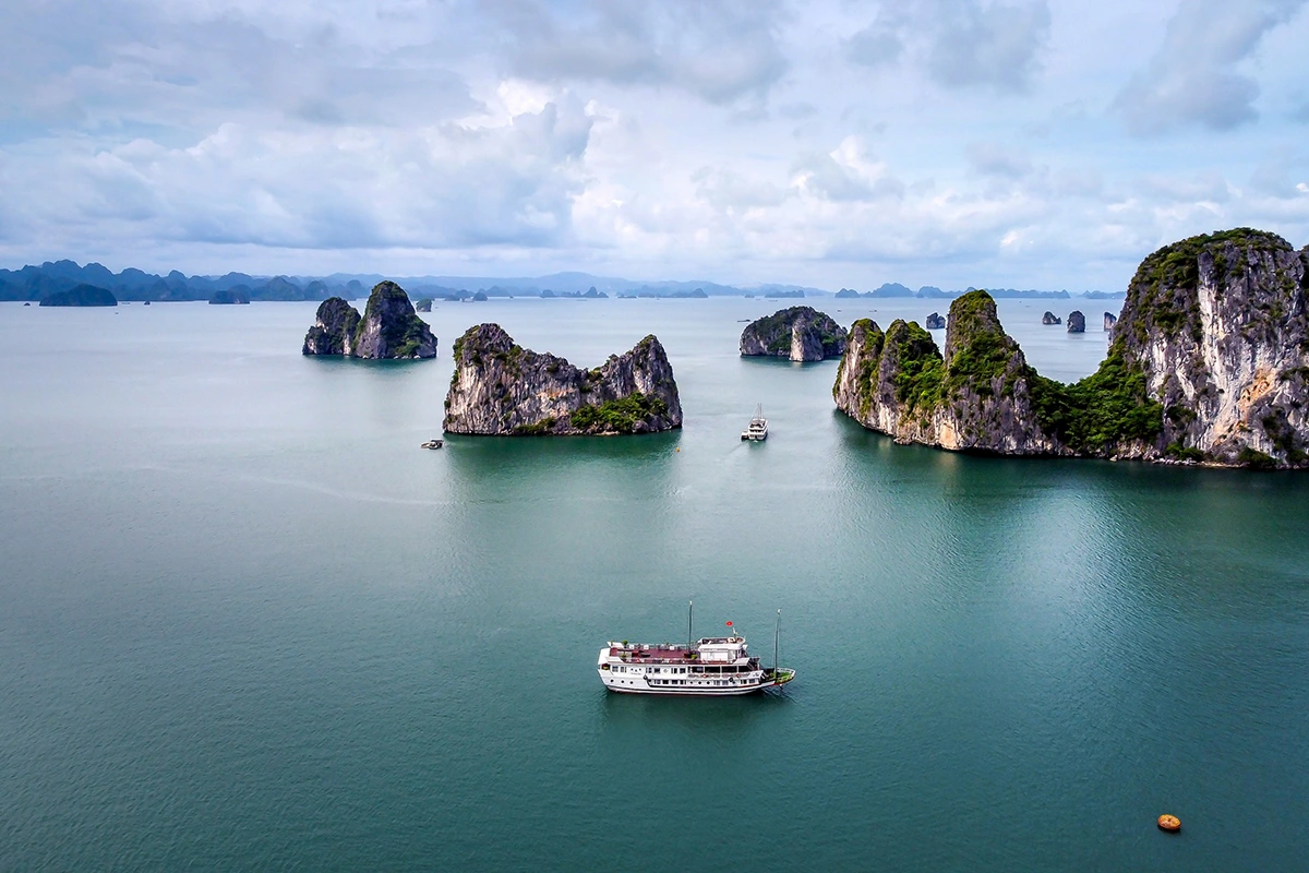 Lan Ha Bay vs Halong Bay: scenic limestone islands and cruise boats