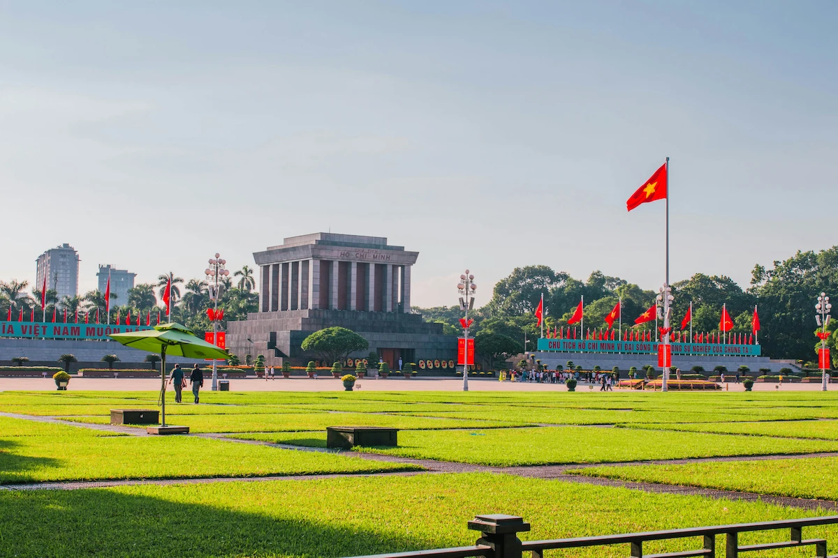 Ho Chi Minh Mausoleum and Vietnamese flags at Ba Dinh Square in Hanoi