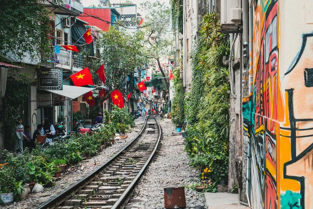 Railway tracks pass between narrow houses on Hanoi Train Street
