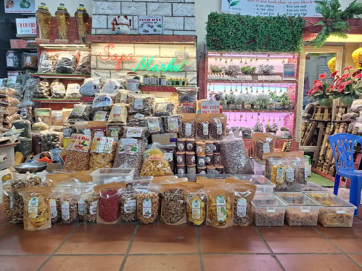 Sapa travel guide: market stall displaying nuts, dried fruits, and local products
